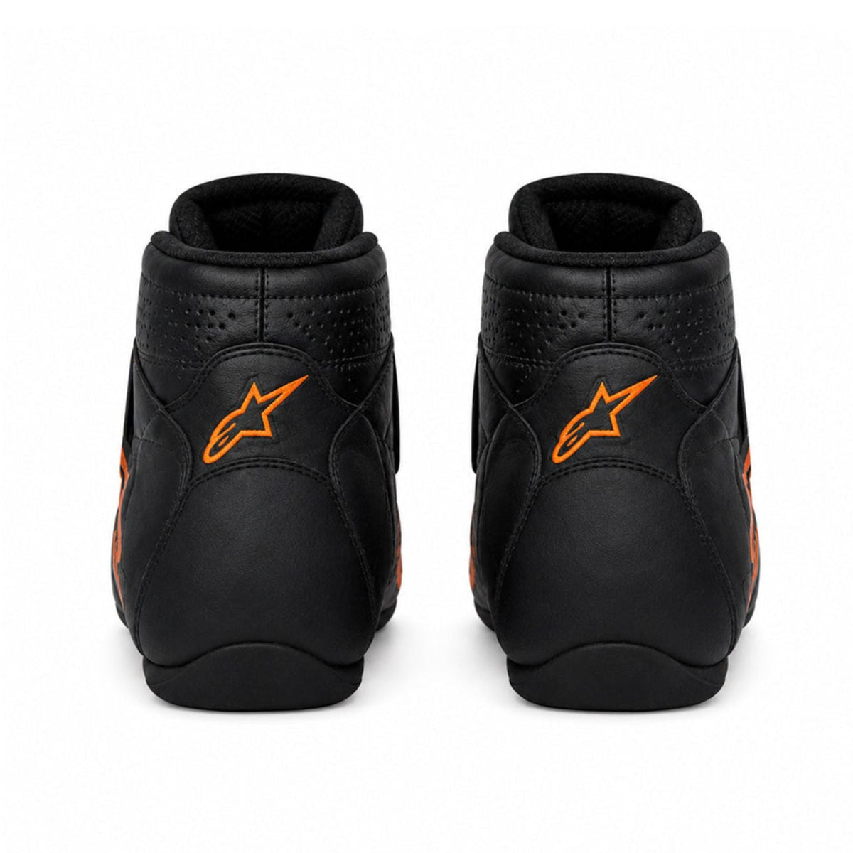Oscar Piastri 2026 Racing Shoes Replica: a pair of black Alpinestars mid-high racing boots shown from the rear, featuring a prominent orange logo on the back and orange accents on the sides.