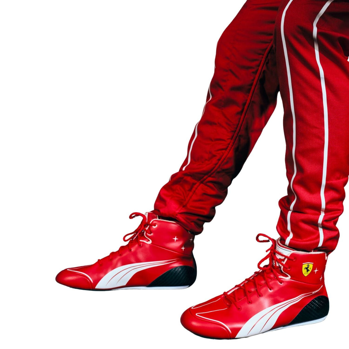 2026 Racing Shoes Replica – Italian GP: red high-top racing shoes with white and black accents worn with matching red track pants featuring white side stripes.