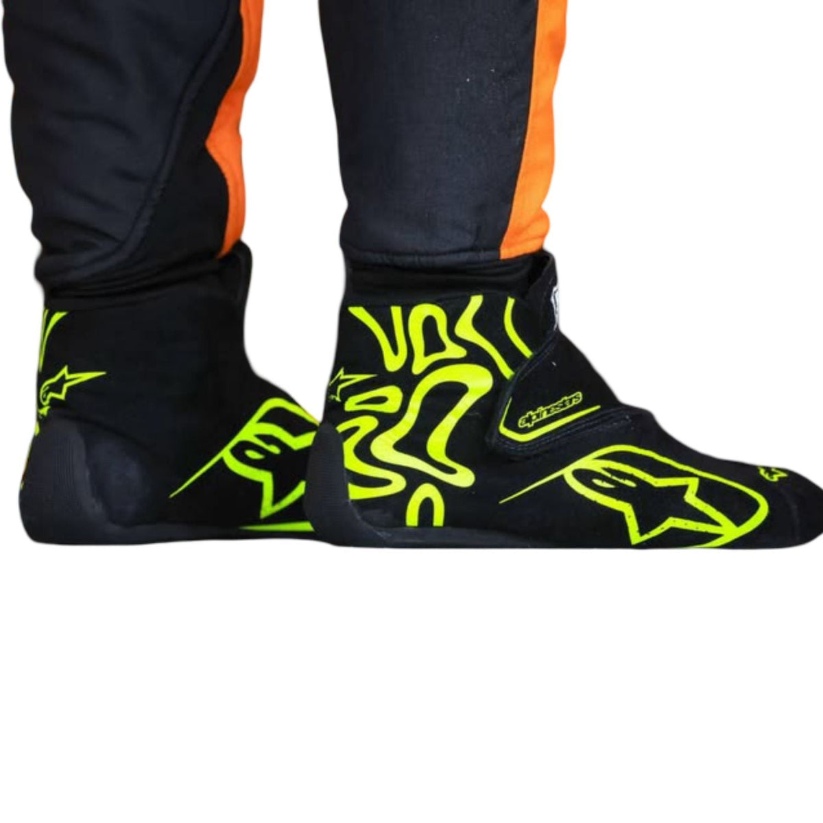 Lando Norris Racing Shoes Replica 2026: black Alpinestars racing boots with bright neon yellow-green graphics and orange side stripes.
