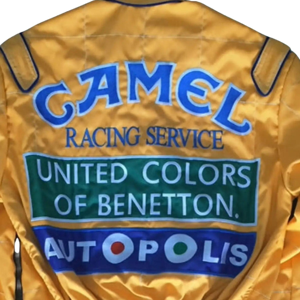 Michael Schumacher 1991 Racing Suit Replica: yellow Michael Schumacher 1991 F1 Race Replica Costume Benetton Ford with Camel, United Colors of Benetton, and Autopolis branding.