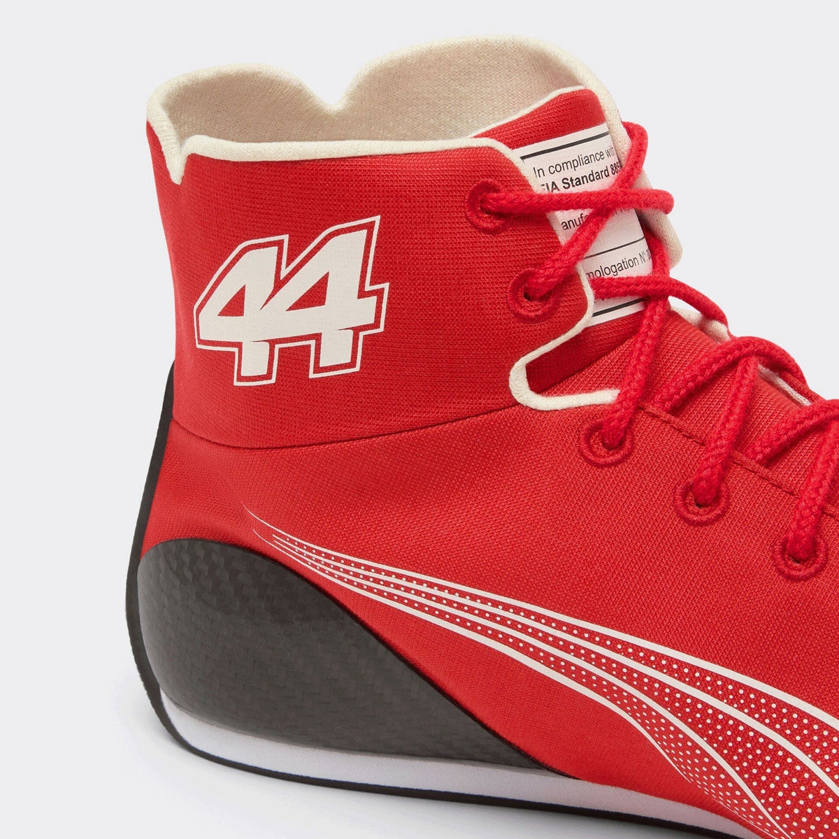 Lewis Hamilton Racing Shoes Replica 2026: a close-up of a red high-top athletic shoe with white and red detailing, featuring the number 44 on the side and red laces.