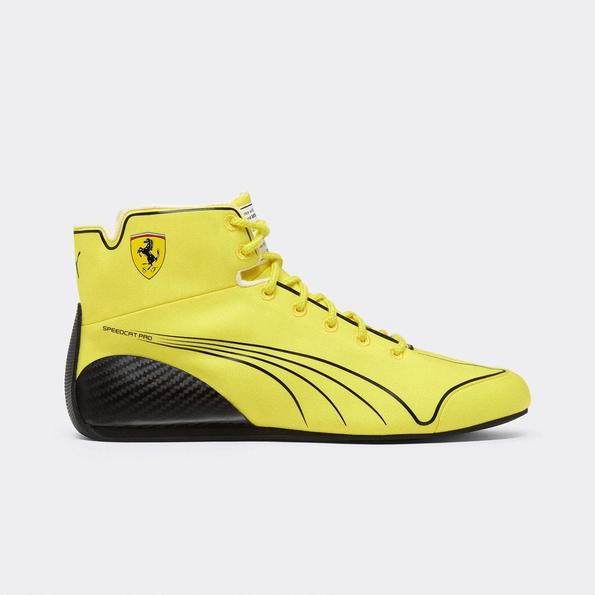 2026 Lewis Hamilton British GP Racing Shoes Replica: a bright yellow high-top Scuderia Ferrari Speedy Pro sneaker with black carbon fiber detailing on the sole and black graphic lines on the side.